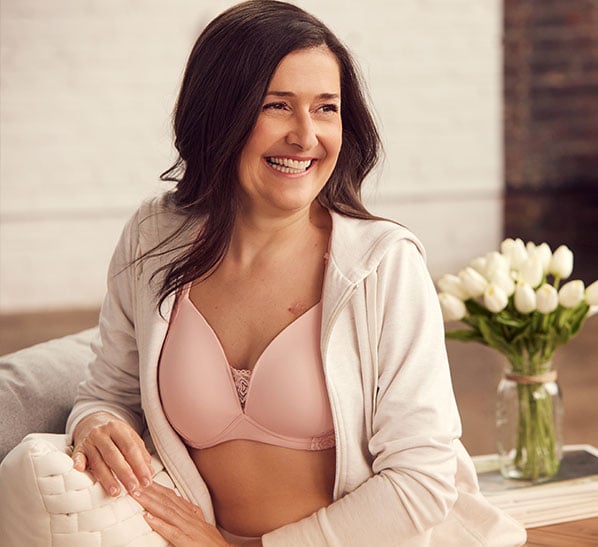 Image of woman wearing loungewear and pink bra